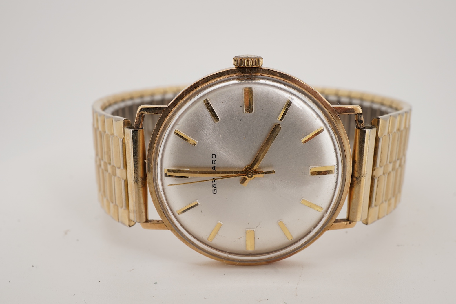 A gentleman's 1970's gold manual wind wrist watch, retailed by Garrard
